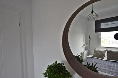 Łóżko lub łóżka w pokoju w obiekcie Apartament West Wrocław / Parking Free