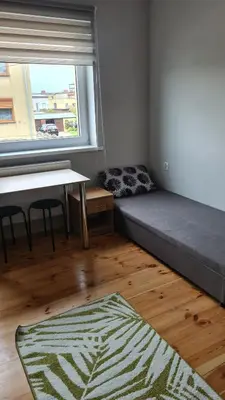 Łóżko lub łóżka w pokoju w obiekcie Polna 40