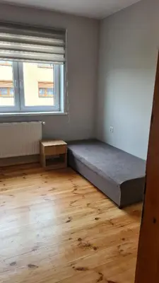 Łóżko lub łóżka w pokoju w obiekcie Polna 40