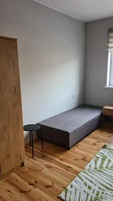 Łóżko lub łóżka w pokoju w obiekcie Polna 40