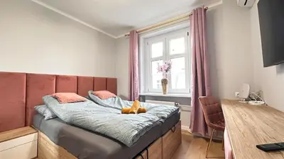 Łóżko lub łóżka w pokoju w obiekcie Apartament Złoty w Opolu