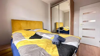 Łóżko lub łóżka w pokoju w obiekcie Apartament Złoty w Opolu
