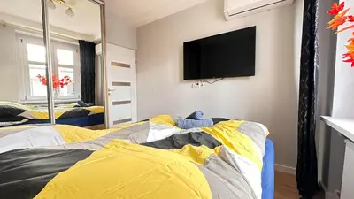 Łóżko lub łóżka w pokoju w obiekcie Apartament Złoty w Opolu