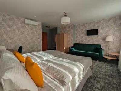 Łóżko lub łóżka w pokoju w obiekcie Sztuka Smaku - Restauracja i Hotelik