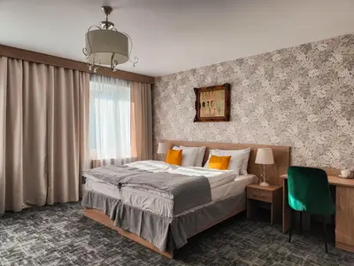 Łóżko lub łóżka w pokoju w obiekcie Sztuka Smaku - Restauracja i Hotelik