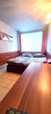 Łóżko lub łóżka w pokoju w obiekcie Oaza