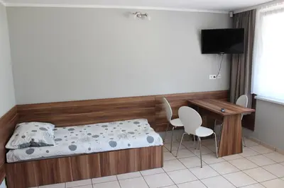 Łóżko lub łóżka w pokoju w obiekcie Oaza