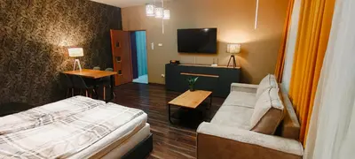 Łóżko lub łóżka w pokoju w obiekcie Mieszkanie z Ogrodem