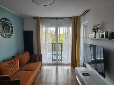 Telewizja i/lub zestaw kina domowego w obiekcie MICHALCZYKA APARTAMENT