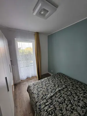 Łóżko lub łóżka w pokoju w obiekcie MICHALCZYKA APARTAMENT