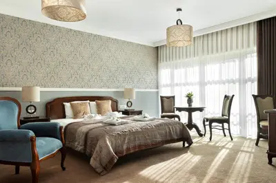 Łóżko lub łóżka w pokoju w obiekcie Hotel Spa Laskowo