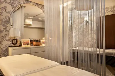 Łóżko lub łóżka w pokoju w obiekcie Hotel Spa Laskowo