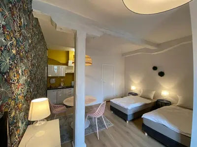 Łóżko lub łóżka w pokoju w obiekcie Studio Rynek 32