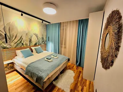 Łóżko lub łóżka w pokoju w obiekcie Eddie's Luxury Apartments