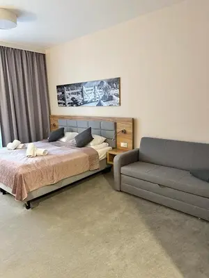 Łóżko lub łóżka w pokoju w obiekcie RentResidence apartament
