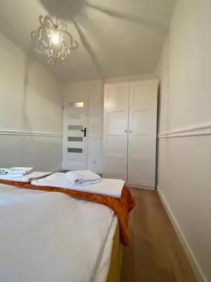 Łóżko lub łóżka w pokoju w obiekcie Tabago Studio 13 K-K Wierzbowa