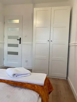 Łóżko lub łóżka w pokoju w obiekcie Tabago Studio 13 K-K Wierzbowa