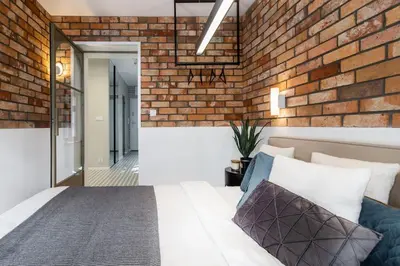 Łóżko lub łóżka w pokoju w obiekcie Stylowy apartament nad Odrą
