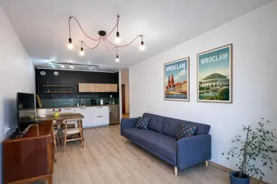 Telewizja i/lub zestaw kina domowego w obiekcie Dmowskiego 19C Tectum Apartments