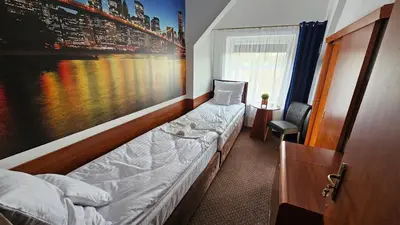 Łóżko lub łóżka w pokoju w obiekcie Willa Furtak