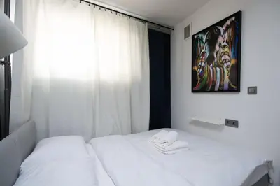 Łóżko lub łóżka w pokoju w obiekcie Rynek Wrocław Comfort Apartment by BookingHost