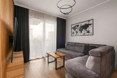 Część wypoczynkowa w obiekcie Jesionowe Apartamenty Ashwood Apartments Widok na Odrę 1,4 km od Rynku Parking Podziemny w Cenie Klimatyzacja Sauna w 1 Apt River Oder view 1,4 km Market Square Underground parking Balcony Air conditioning