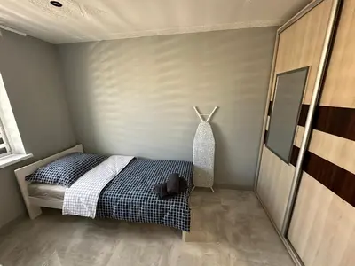 Łóżko lub łóżka w pokoju w obiekcie Apartament Kościuszko