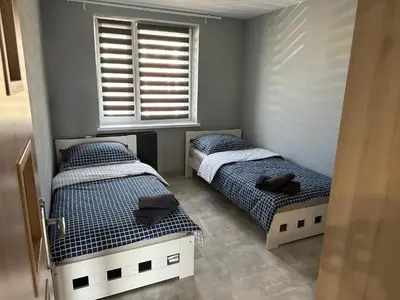 Łóżko lub łóżka w pokoju w obiekcie Apartament Kościuszko