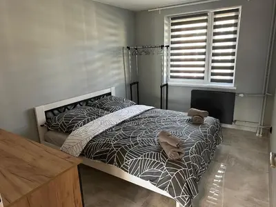 Łóżko lub łóżka w pokoju w obiekcie Apartament Kościuszko