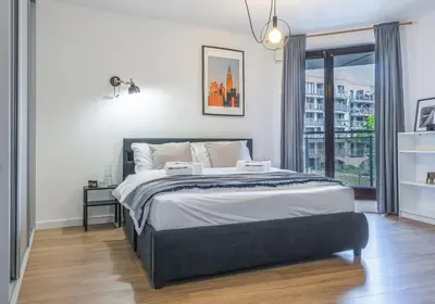 Łóżko lub łóżka w pokoju w obiekcie Apartament w Śródmieściu Odnowa