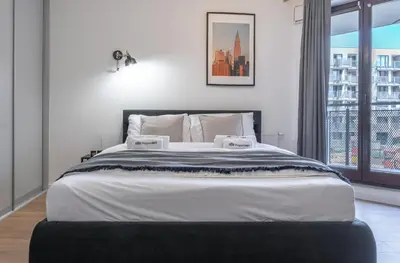 Łóżko lub łóżka w pokoju w obiekcie Apartament w Śródmieściu Odnowa