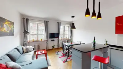 Telewizja i/lub zestaw kina domowego w obiekcie Rynek Market Square Wroclove Tectum Apartments z widokiem na Rynek