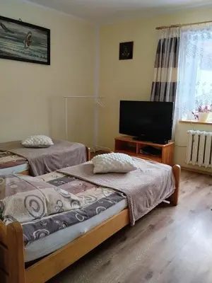 Łóżko lub łóżka w pokoju w obiekcie Zacisze Sokolec