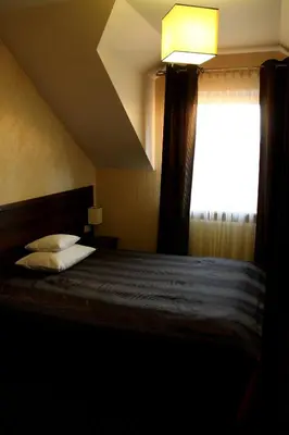 Łóżko lub łóżka w pokoju w obiekcie Hotel Linder