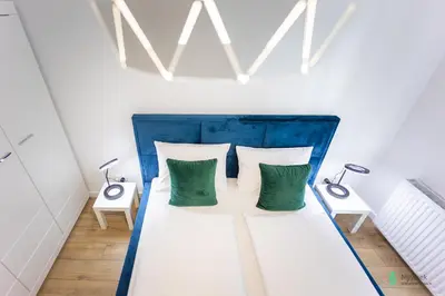 Łóżko lub łóżka w pokoju w obiekcie Apartament Bluszczowy, MyWeek