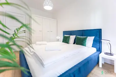 Łóżko lub łóżka w pokoju w obiekcie Apartament Bluszczowy, MyWeek