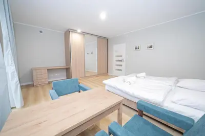 Łóżko lub łóżka w pokoju w obiekcie VacationClub - Zdrojowa 7 Apartament 3