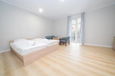 Łóżko lub łóżka w pokoju w obiekcie VacationClub - Zdrojowa 7 Apartament 3