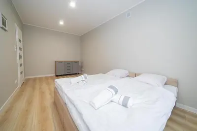 Łóżko lub łóżka w pokoju w obiekcie VacationClub - Zdrojowa 7 Apartament 4