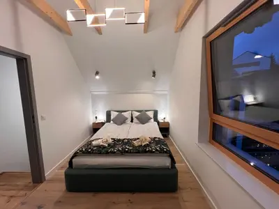 Łóżko lub łóżka w pokoju w obiekcie Villa Monte Apartament z ogrodem