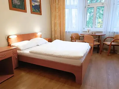 Łóżko lub łóżka w pokoju w obiekcie Willa Storczyk Polanica Zdrój
