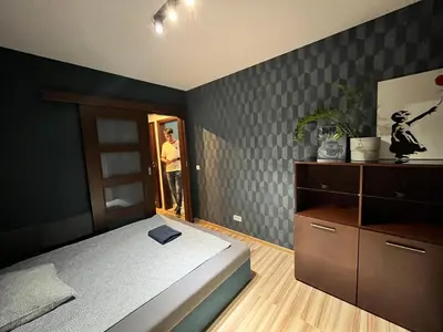 Łóżko lub łóżka w pokoju w obiekcie Family House Pomorska 32 Centrum Tectum Apartments