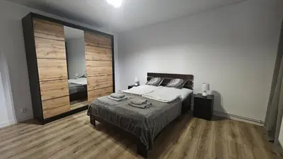 Łóżko lub łóżka w pokoju w obiekcie Apartament Tuwima 1