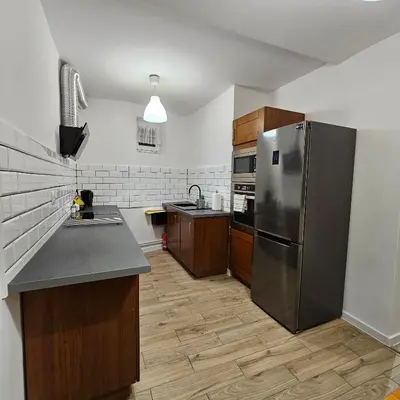 Kuchnia lub aneks kuchenny w obiekcie Apartament Tuwima 1
