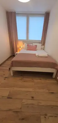 Łóżko lub łóżka w pokoju w obiekcie Apartament Roanta