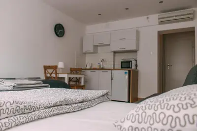 Łóżko lub łóżka w pokoju w obiekcie Pokoje gościnne przy Ogrodzie Staromiejskim