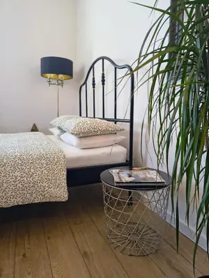 Łóżko lub łóżka w pokoju w obiekcie Apartament Wieżyczka