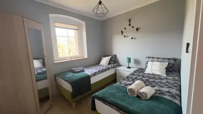 Łóżko lub łóżka w pokoju w obiekcie Sasanka LZ