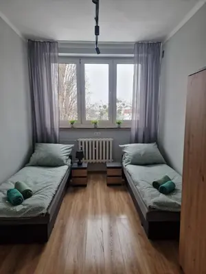 Łóżko lub łóżka w pokoju w obiekcie CZARNA PERŁA