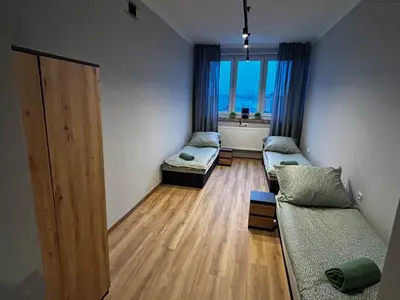 Łóżko lub łóżka w pokoju w obiekcie CZARNA PERŁA